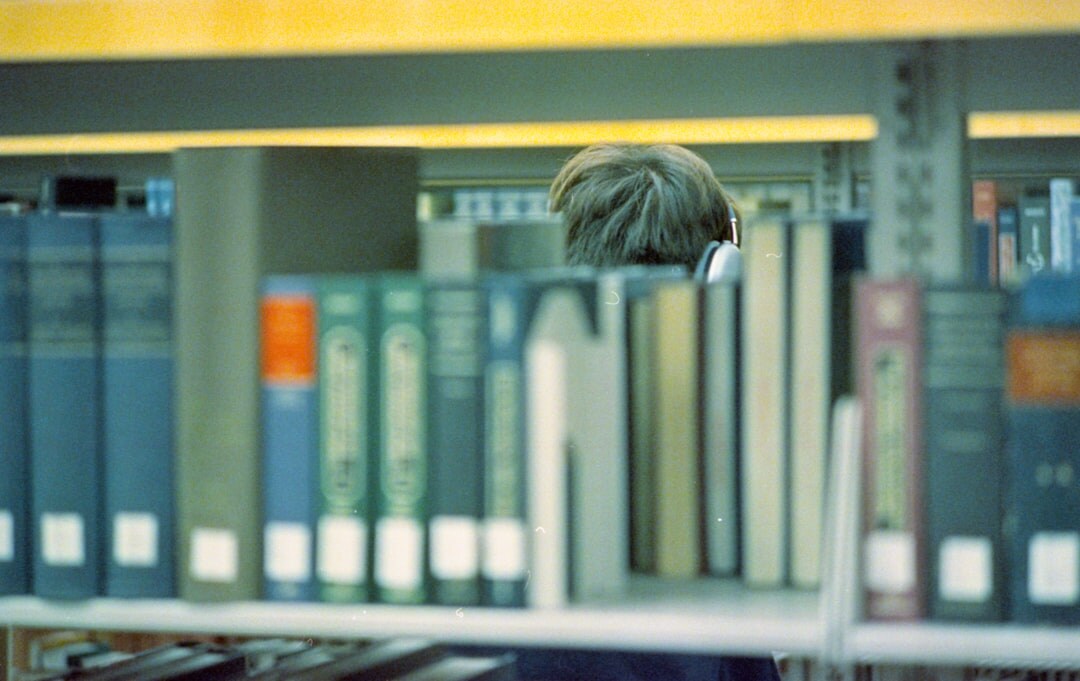 person reading book in quiet space