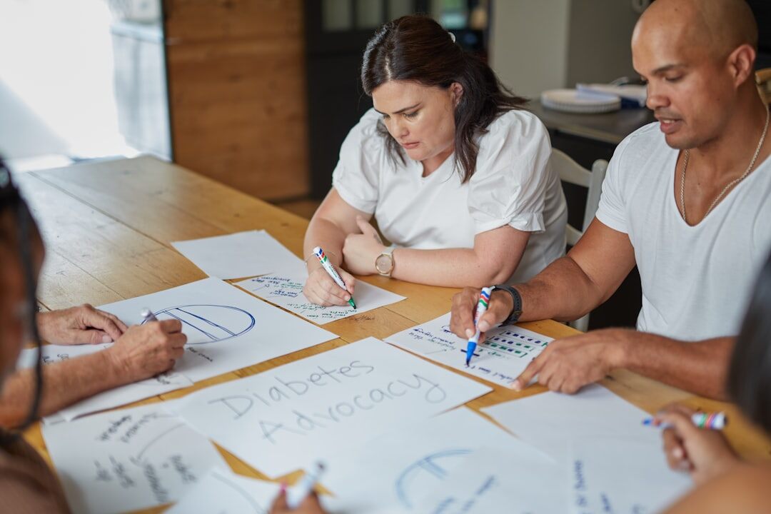 Brazilian writers collaborating around a table with notes