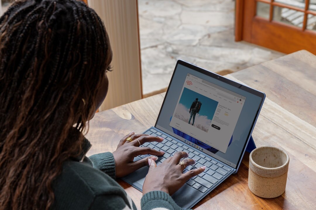 Brazilian woman writing an article on a laptop