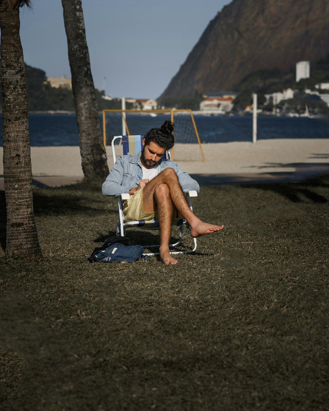 Brazilian man smiling while writing a message