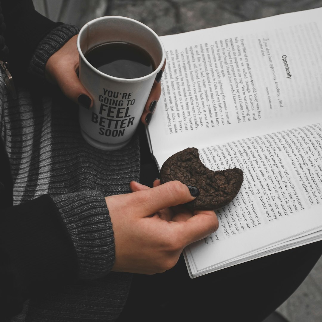 Brazilian woman journaling with a cup of coffee